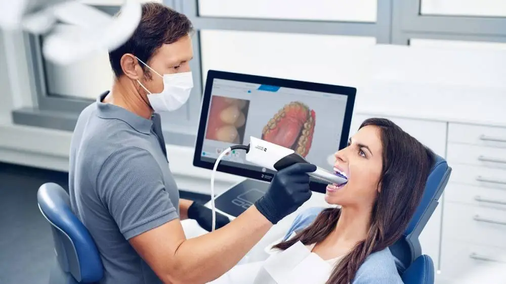 Dentist using intraoral scanner for digital dental impressions